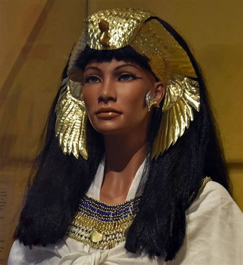 An Egyptian Woman S Head Wearing Gold Jewelry