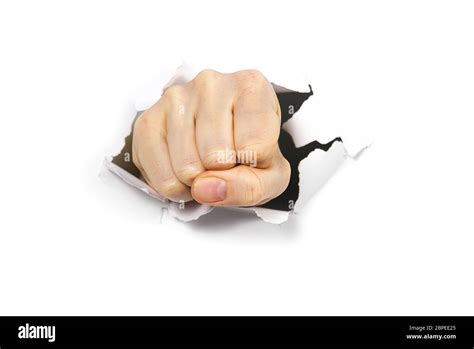 Hand Punching Through White Paper Hi Res Stock Photography And Images