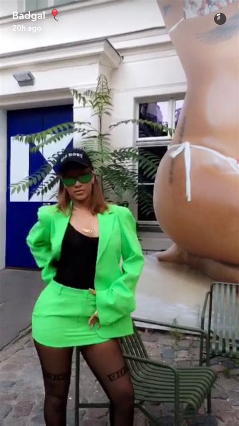 this is what rihanna wears to photoshoot with a headless statue of herself fpn