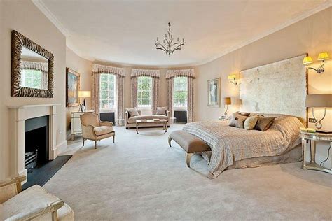 Curved Walls And A World Of Beige Greet You Inside This Bedroom Beige