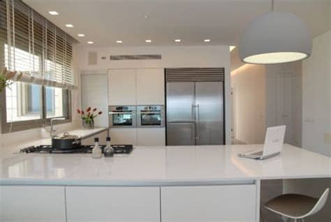 In an effort to add more light to the space, the ceiling is covered in a textured orange. 20 L-shaped kitchen design ideas to inspire you