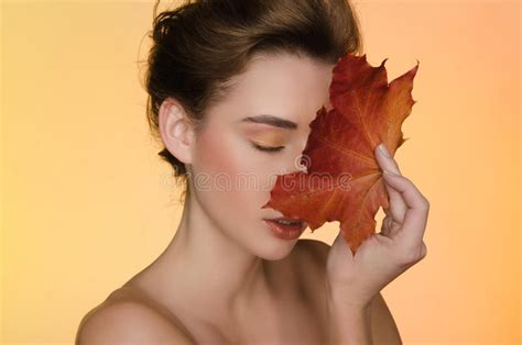 Woman With Maple Autumn Leaves On Yellow Background Stock Image Image