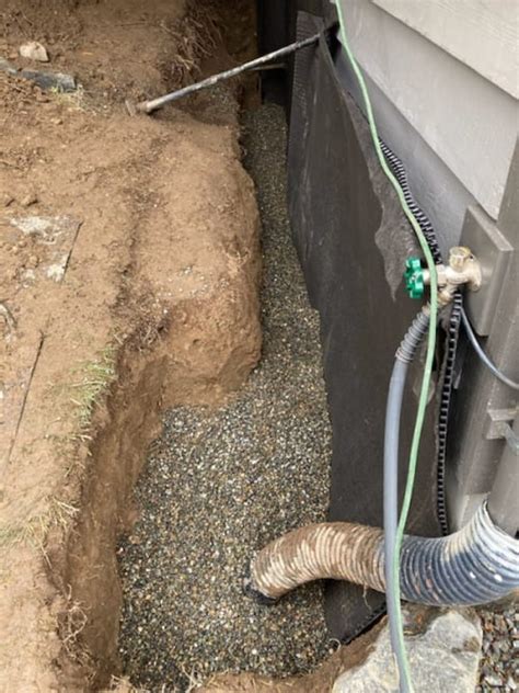 The footer drain helps discharge water away form the home, while the gravel fill works to alleviate hydrostatic pressure. Jeff W. Exterior Basement Waterproofing Lake Forest Park
