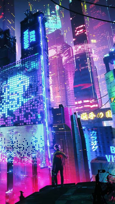 A Man Standing In The Middle Of A City With Tall Buildings And Neon