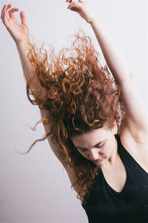 A Redhead Dancer Moving And Stretching Her Hair Is Caught Up In The Movement Del Colaborador