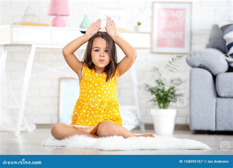 Little Girl Sitting On White Carpet Stock Image Image Of Girl Dress