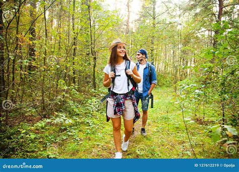 Tough Route Beautiful Young Couple Hiking Together In The Woods While