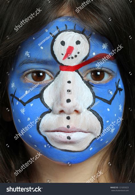 Pretty Girl With Face Painting Of A Snowman Stock Photo