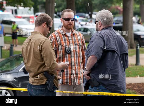 Plain Clothes Police Officers Meeting At A Crime Scene Washington Dc
