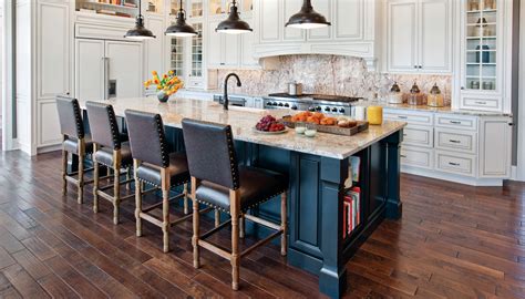 Dark cabinets and pops of color are trending in the kitchen this year