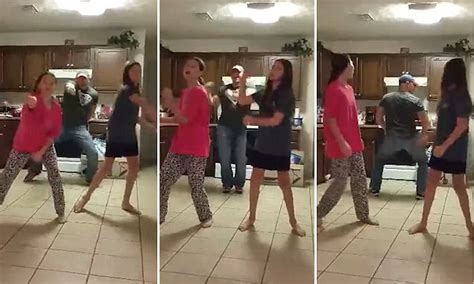 father of two girls practising the whip nae nae sneaks up behind them in video daily mail online