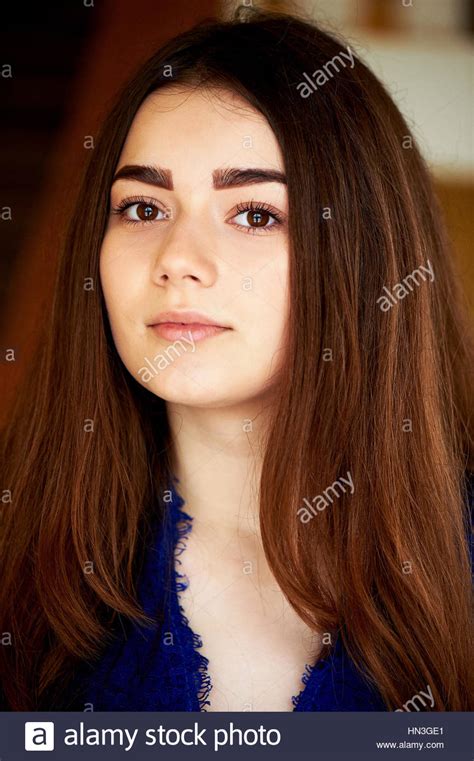 Young Girl Looking At The Camera Long Dark Hair And Brown