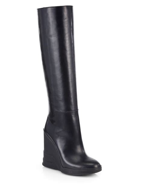 Lyst Prada Leather Knee High Wedge Boots In Black