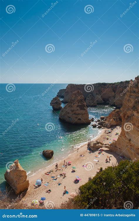 Algarve Coast Portugal People In The Beach And Blue Water Stock Image