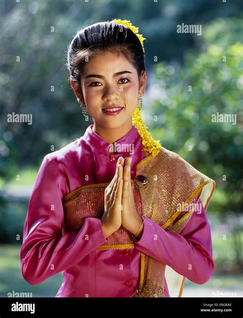 the-wai,-a-thai-gesture-of-greeting,-young-woman-wearing-a-stock-photo-75962838-alamy