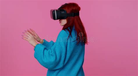 girl using virtual reality futuristic technology vr headset helmet to play simulation 3d video