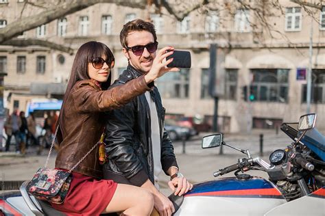 Couple Taking Selfie On The Motorbike By Stocksy Contributor Mosuno