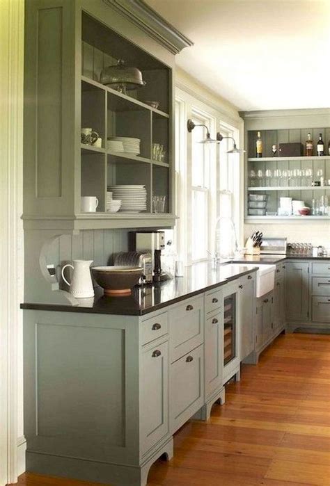 Sleek black cabinets and dark wood tones make this kitchen warm and cozy all throughout the year. 22 Stunning Farmhouse Style Cottage Kitchen Cabinets Ideas ...