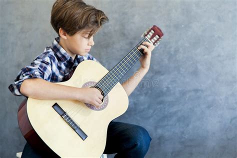 Teen Boy Playing Acoustic Guitar Stock Image Image Of Handsome