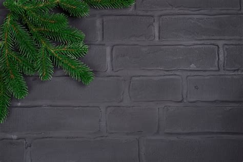 Premium Photo Christmas Tree On Brick Wall Background