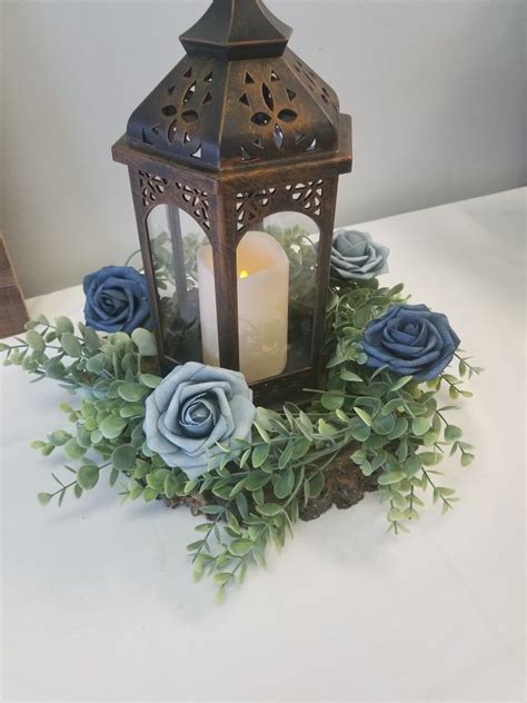 Wood Slab Slate Blue And Baby Blue Lantern And Frosted Eucalyptus