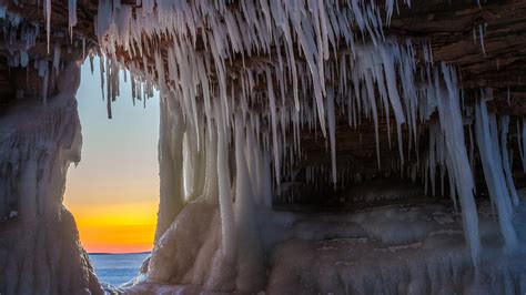 Sunset View From A Cave Full Of Icicle Wallpaper Download 3840x2160