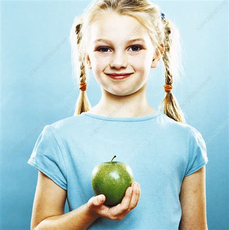 Girl Holding An Apple Stock Image P9200747 Science Photo Library