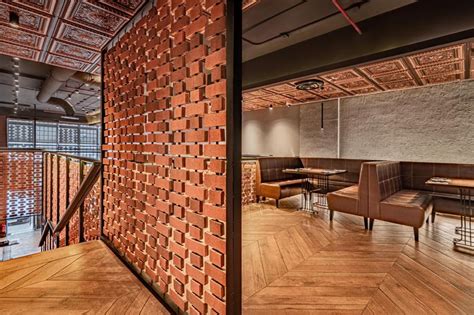 Open Brick Walls Act As Screens Inside This Restaurant