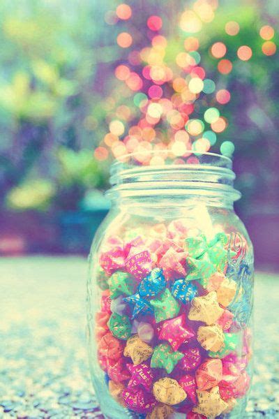 A Jar Filled With Gummy Bears Sitting On Top Of A Table