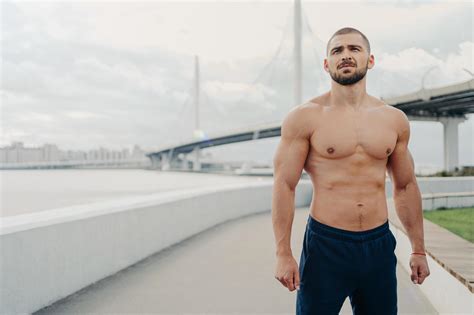 Handsome Muscular Man With Naked Torso Has Outdoor Fitness Workout