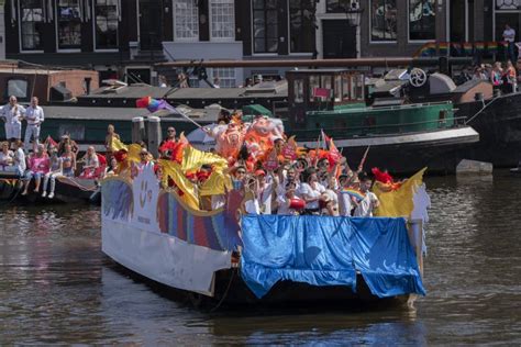 asian pride boat at the gaypride canal parade with boats at amsterdam the netherlands 6 8 2022