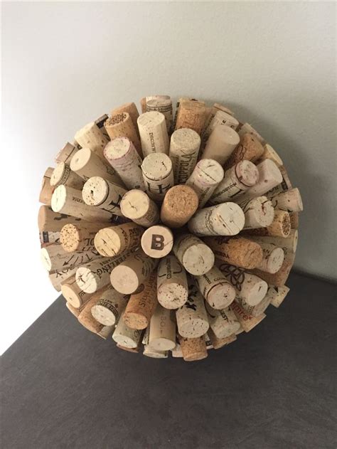 A Bunch Of Wine Corks Sitting On Top Of A Table Next To A Wall