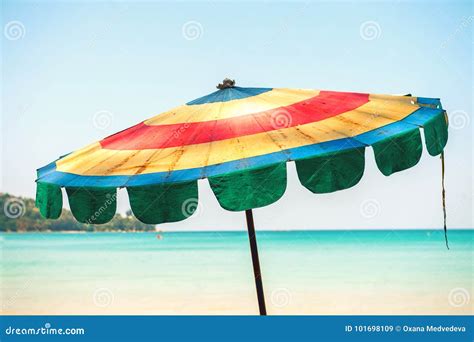 Beautiful Colorful Beach Umbrella From Striped Fabric On A Background