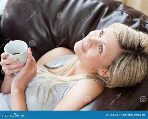 Charming Woman Drinking Coffee Sitting On A Sofa Stock Image Image Of Home Adult