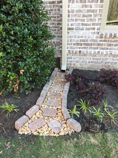 A Brick Walkway In Front Of A House