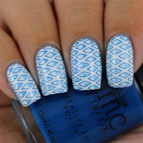 White almond acrylic nails with glitter stamping accent nail design. 15 Perfect Combination of Blue and White Color for Cute ...
