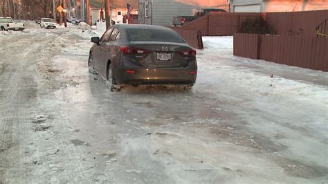 Cars Stuck In Ice After Tremont Water Main Break