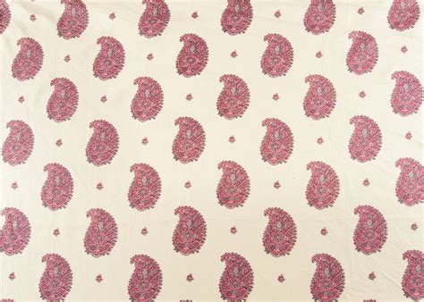 A White And Pink Paisley Print Fabric With Red Dots On The Bottom Half