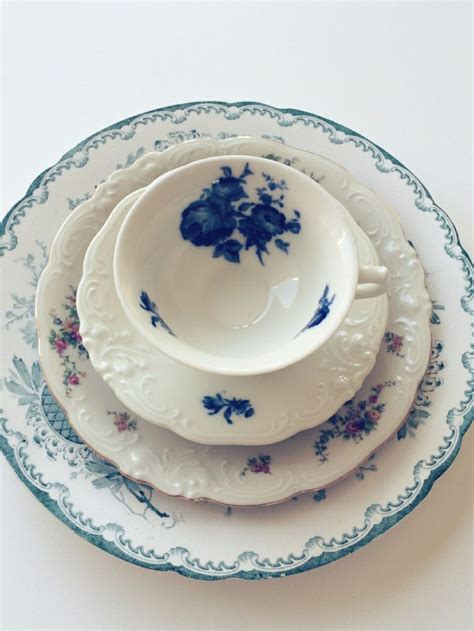 A Stack Of Blue And White Plates Sitting On Top Of Each Other
