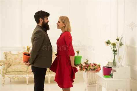 Present Concept Sensual Woman And Bearded Man Hold Flower Present