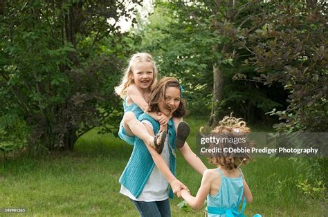 Sisters Playing Ring Around The Rosie High Res Stock Photo Getty Images