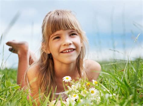 The Smiling Girl Is Lying In The Meadow Stock Photo Image