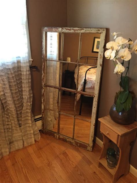 While this dining room is much larger than any of the rooms in my house, i love the idea of using mirror inside the panels. Recycle Old Windows Into DIY Mirrors | Do it yourself ...