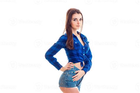 Skinny Beautiful Young Girl Stands In Front Of The Camera In Shorts And