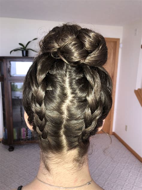 Two Upside Down Dutch Braids Come Together To Form Braided Bun Hair