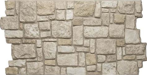 A Stone Wall Made Out Of Small Rocks