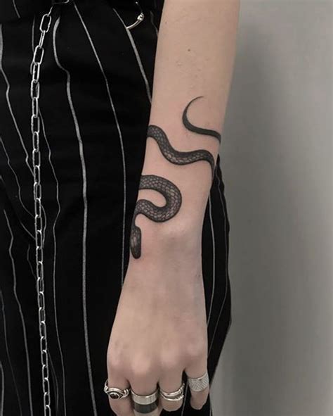Some people choose tattoos meet you behind the quality and design as of great significance. #armtattoo #blacksnake #blacktattoos #snakes #snaketattoo ...