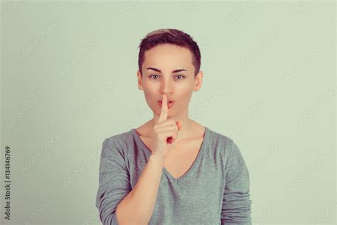 Shh Woman Wide Eyed Asking For Silence Or Secrecy With Finger On Lips