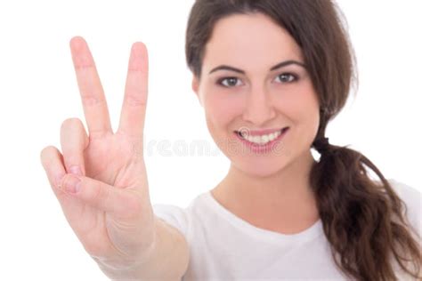 Portrait Of Happy Young Woman Giving Peace Sign Isolated On Whit Stock