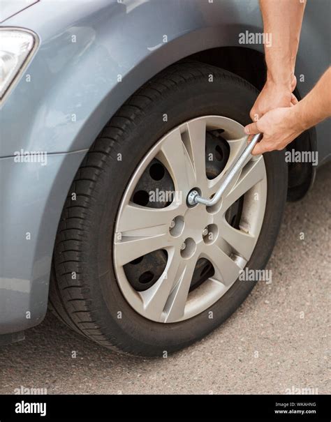 Man Changing Tire Stock Photo Alamy